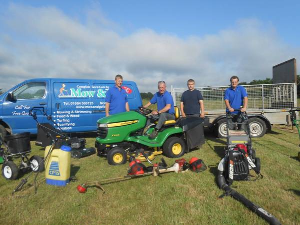 The team with lawn mowing equipment